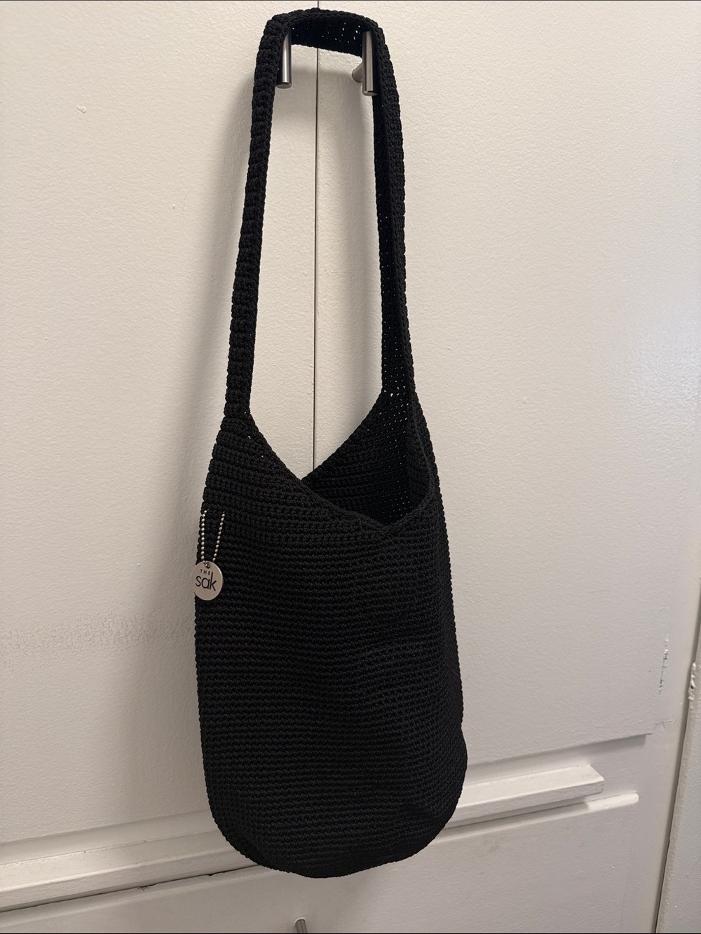 The Sak Black Crochet Shoulder Bag with Logo Charm
